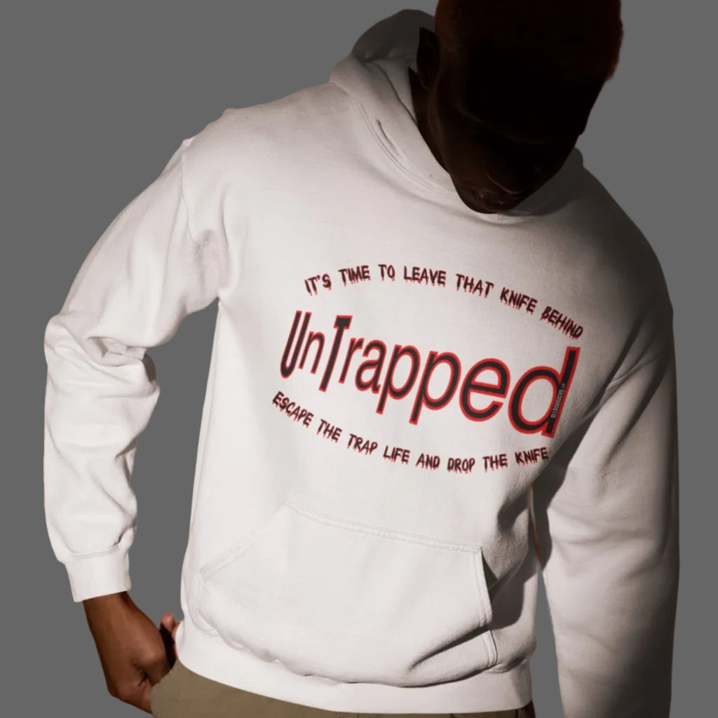 Person wearing a white hoodie with 'Untrapped' text on an orange background