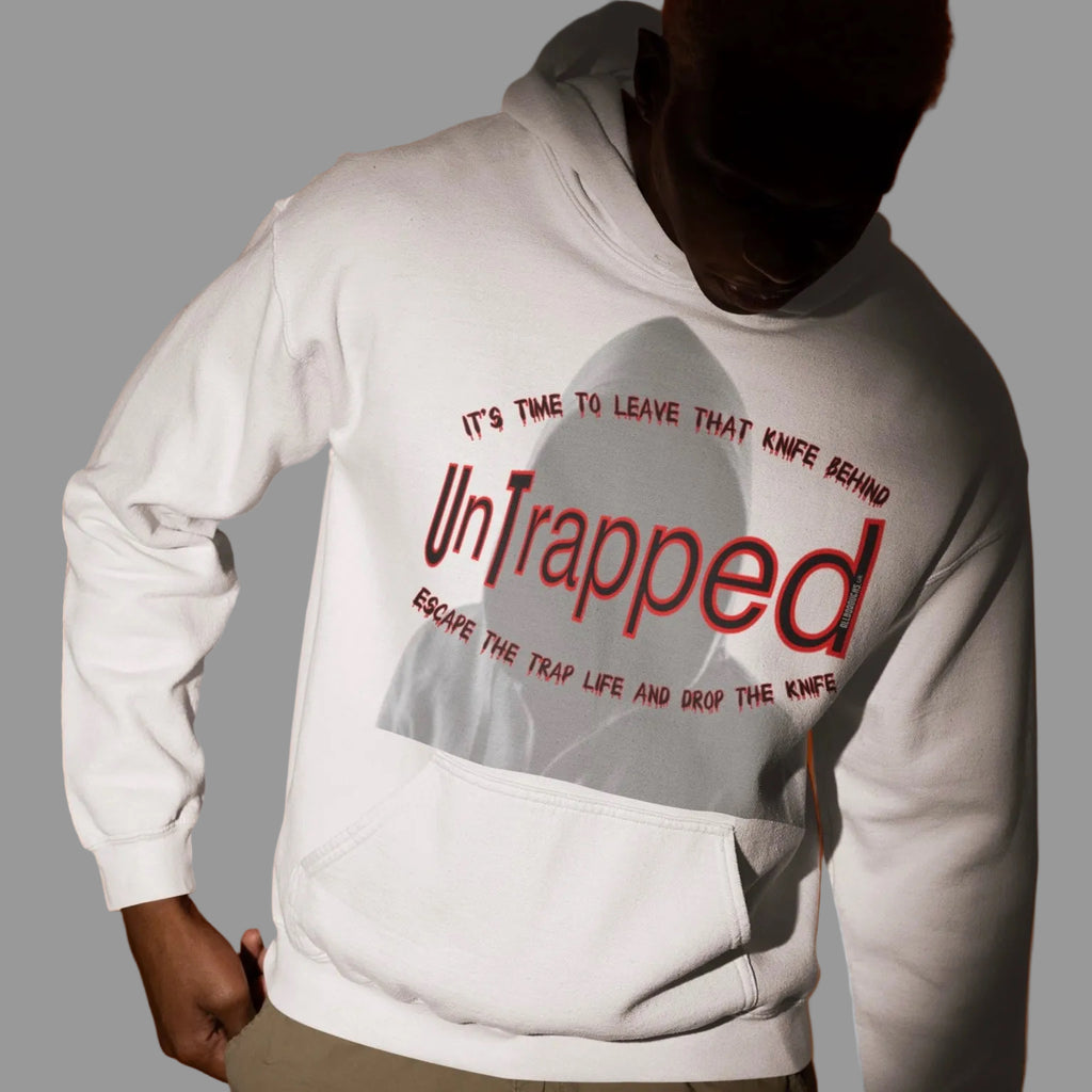 Person wearing an AllBoroughs white hoodie with anti knife text on the front, against a grey background