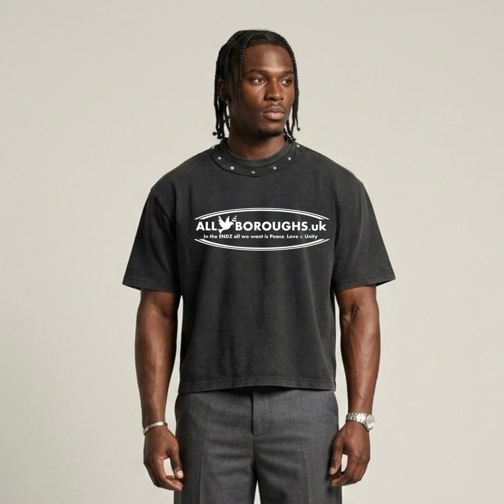 Person wearing a black t-shirt with 'All Boroughs UK' logo on a plain background. Also known as All Boroughs.