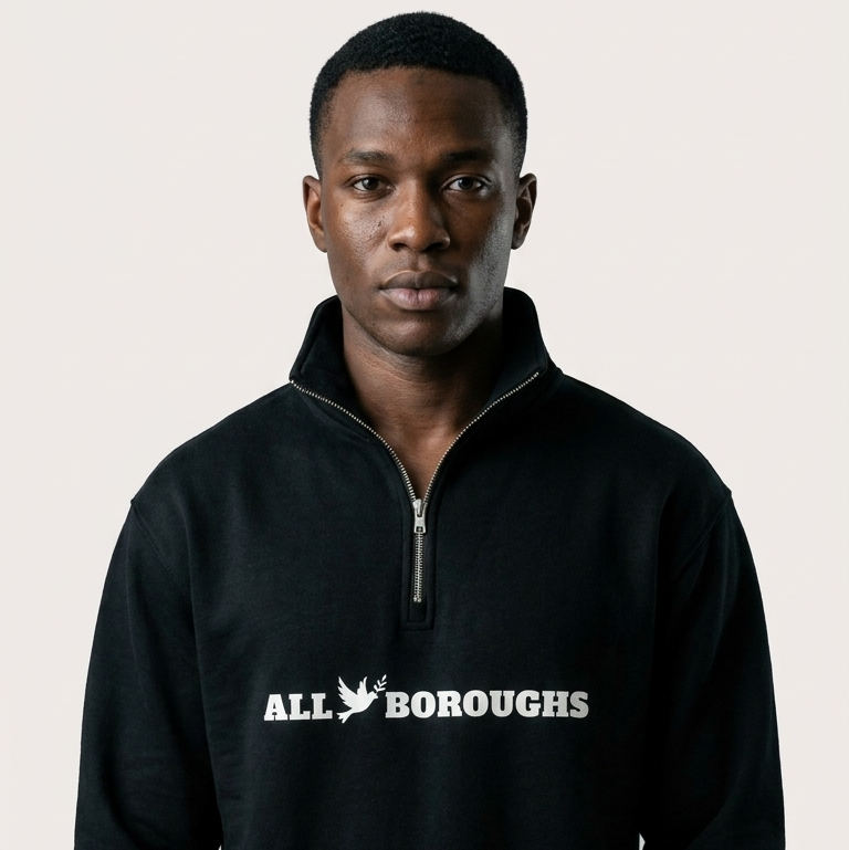 Man wearing a black sweatshirt with 'ALLBOROUGHS' text on a plain background