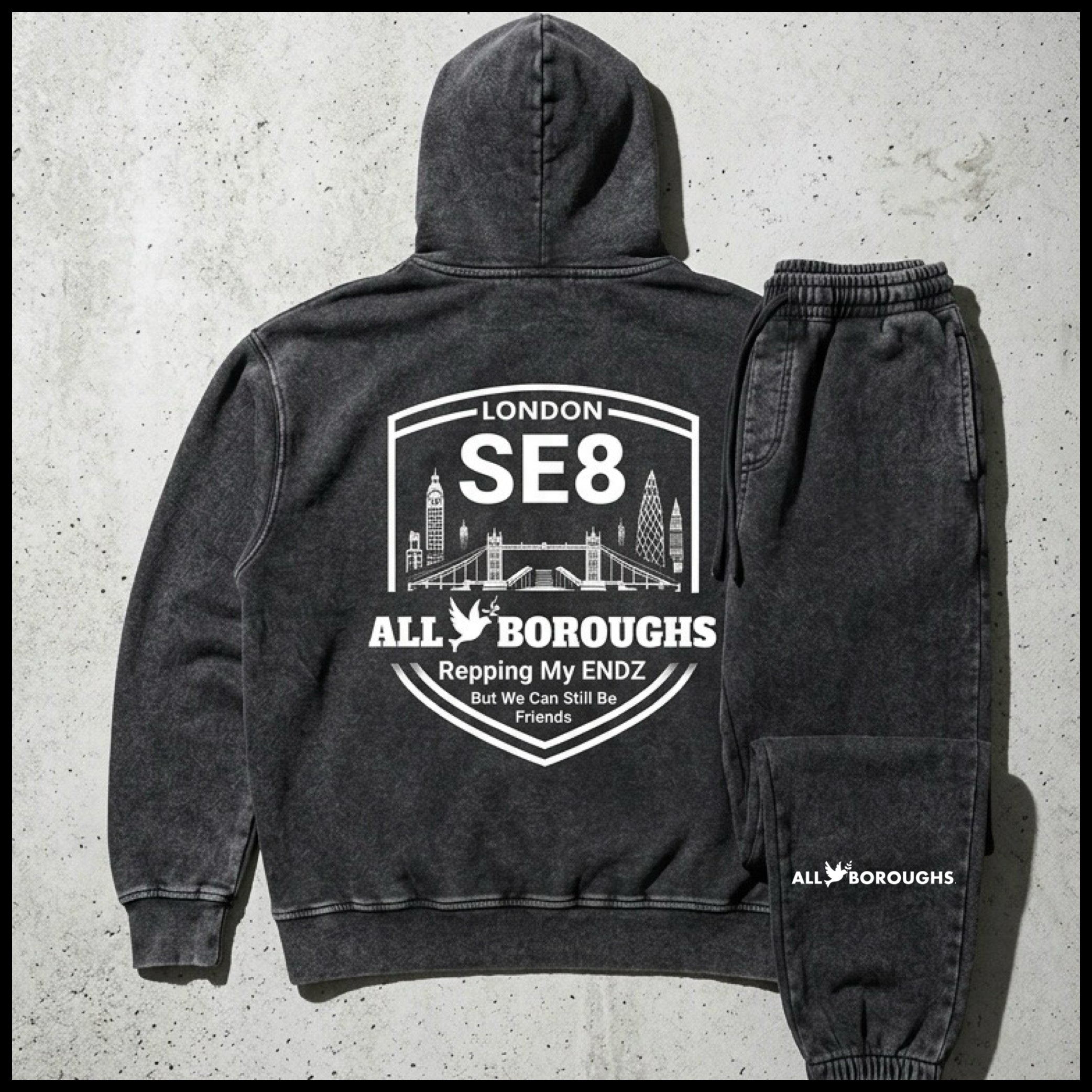 Black hoodie and jogger set with 'All Boroughs' branding on a concrete background. Also known as All Boroughs
