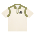 A short-sleeve polo shirt in off-white with sage green contrast panels on the shoulders, collar, and placket. A circular black and white 'AB' Allboroughs crest is printed on the left chest.
