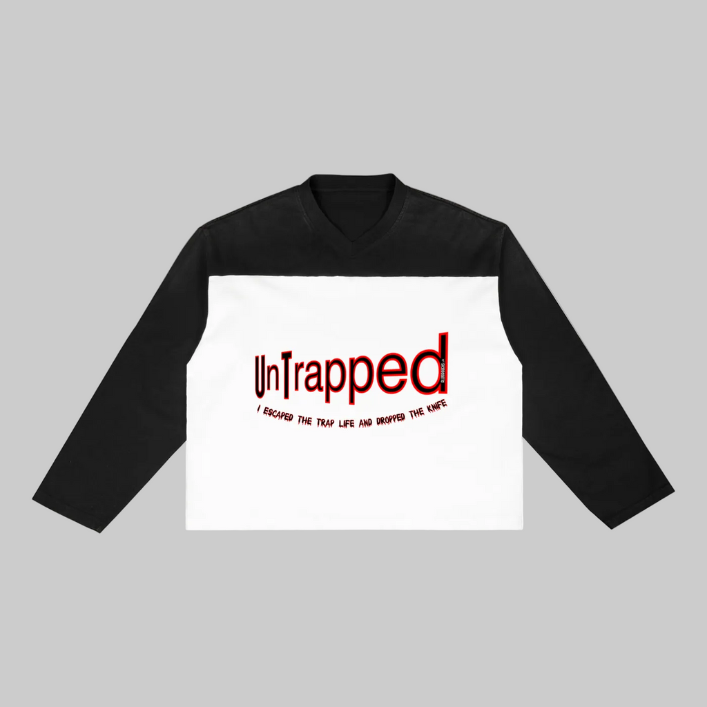 Black and white long-sleeve shirt with 'Untrapped' text on a white background