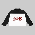 Black and white long-sleeve shirt with 'Untrapped' text on a white background
