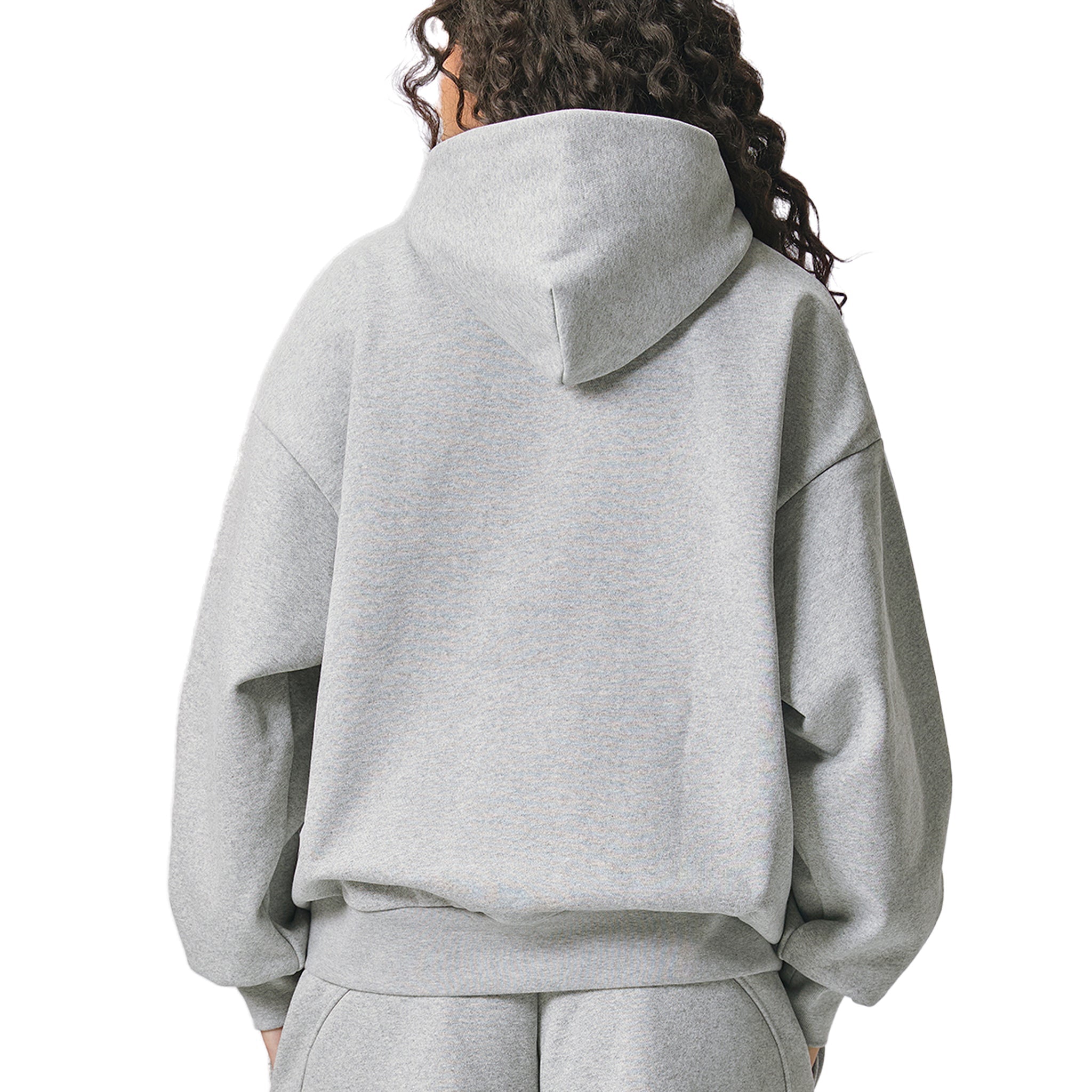 Person wearing a grey AllBoroughs hoodie on a white background